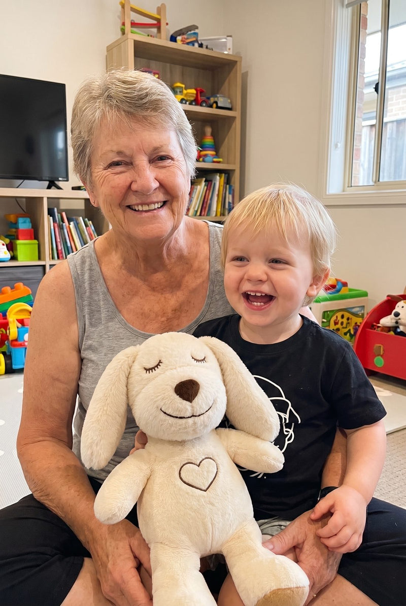 A grandmother and her grandson with a Lulla Pup